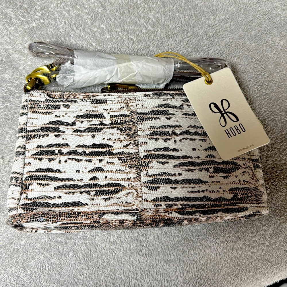 Hobo bag lizard print never used. No storage bag,
